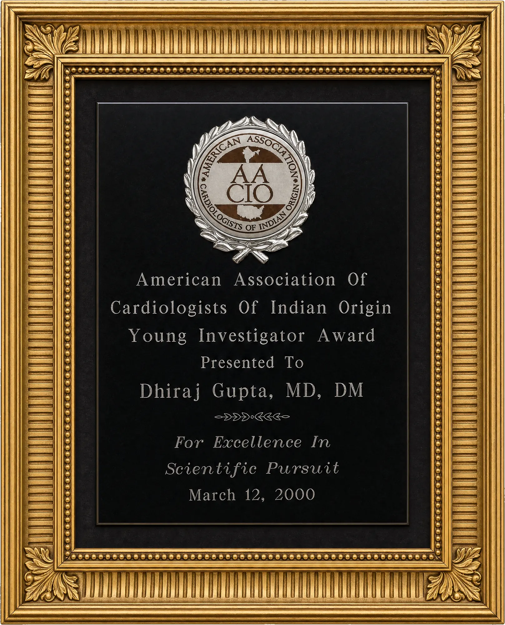 Engraved black plaque awarded to Dhiraj Gupta by the American Association of Cardiologists of Indian Origin, Young Investigator Award for Excellence in Scientific Pursuit, 12 March 2000.