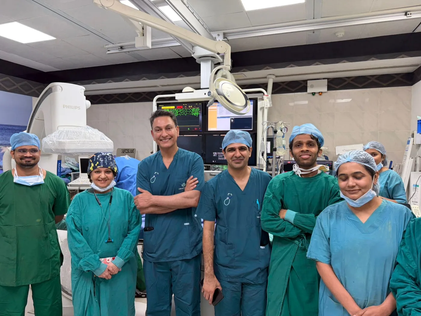 Professor Gupta scrubbed in with the cardiology team in the catheter laboratory at Lilavati Hospital, Mumbai.